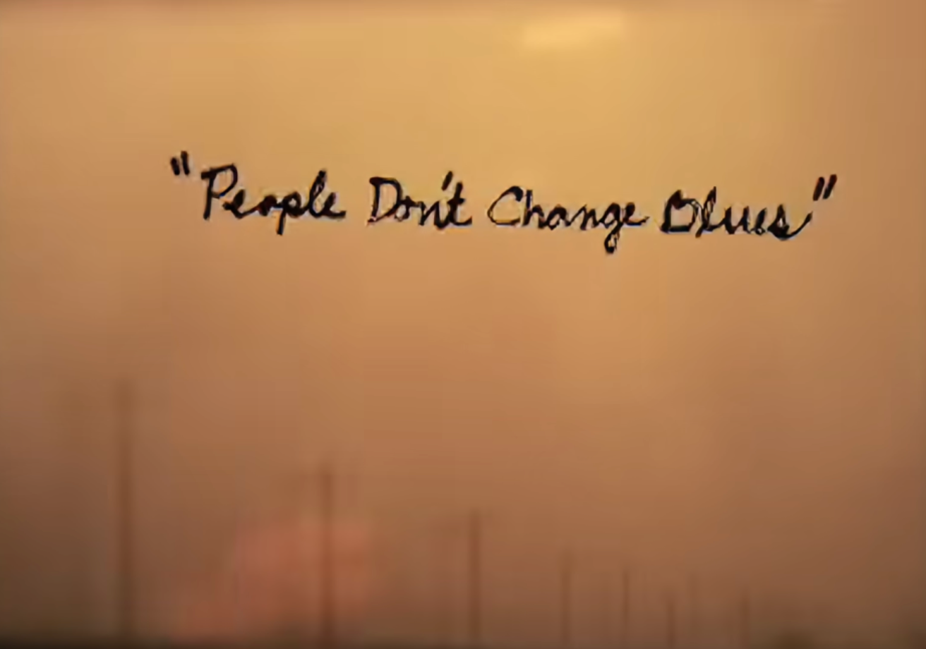 People Don't Change Blues handwritten on a hazy orange background